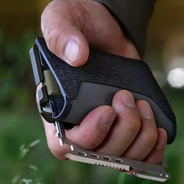 Dango T01 Tactical Bifold Spec Ops wallet with MT02 multi-tool in hand