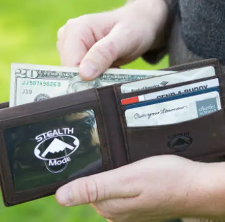 stealth mode lather bifold wallet with money and cards
